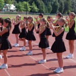 Cheerleaders on track clapping